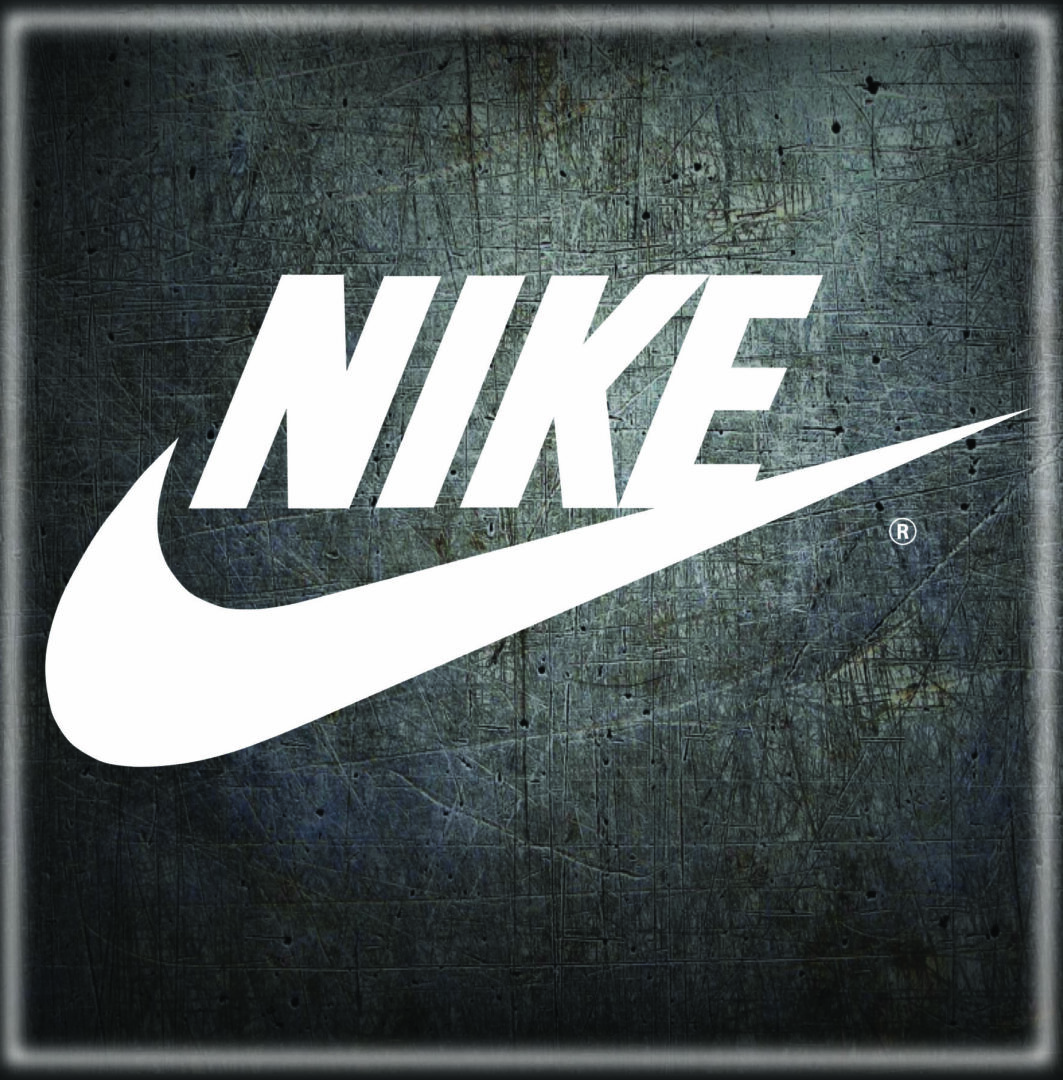A picture of the nike logo on a wall.